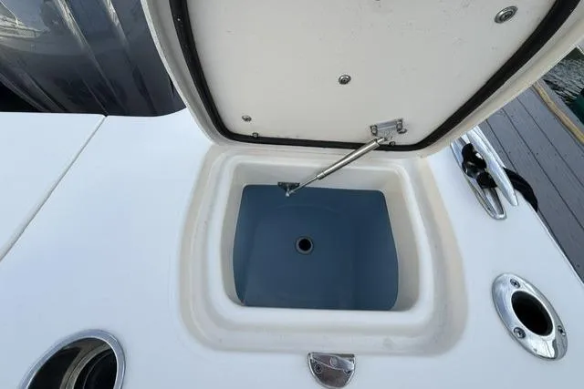 Slide: The Image of Open storage compartment on 2023 Grady-White Canyon 326 boat deck. - 31