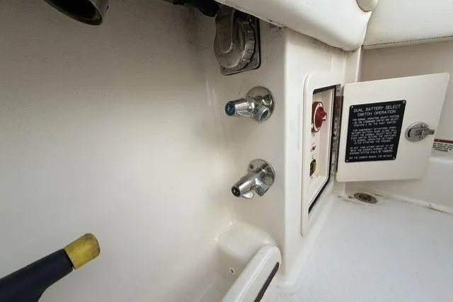 Slide: The Image of 2023 Grady-White Canyon 326 boat control panel with switches and connectors. - 33