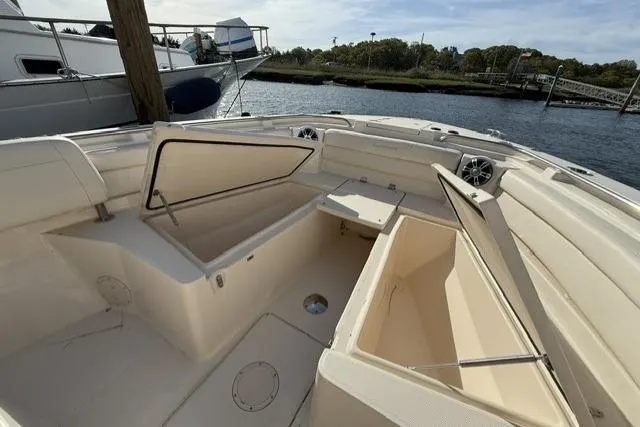Slide: The Image of 2023 Grady-White Canyon 326 boat interior with open storage compartments. - 36