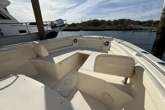 Slide: The Image of 2023 Grady-White Canyon 326 boat interior with spacious seating and scenic water view. - 43