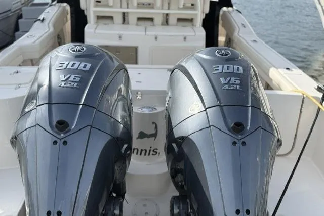 Slide: The Image of 2023 Grady-White Canyon 326 boat with twin 300 V6 engines at dock. - 55