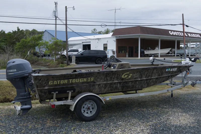The Image of 2022 G3 Gator Tough 18 SC boat with Yamaha motor at marina. - 1