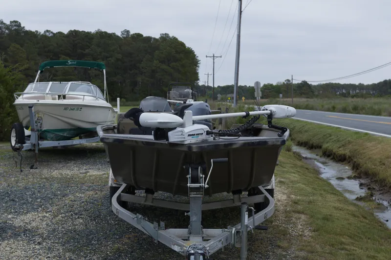 Slide: The Image of 2022 G3 Gator Tough 18 SC boat on trailer beside road. - 3