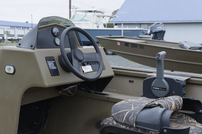 Slide: The Image of 2022 G3 Gator Tough 18 SC boat interior with steering wheel and Yamaha controls. - 5