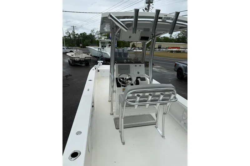 Slide: The Image of 2023 KenCraft 2460 Bayrider boat interior with steering console and rod holders. - 3