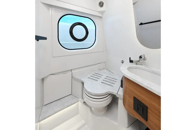 Slide: The Image of Manufacturer Provided Image: Luxurious bathroom interior of 2026 Tiara Yachts 35 LS, featuring modern fixtures and porthole window. - 5