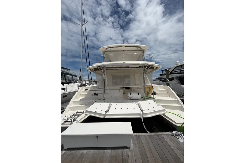 Slide: The Image of 2015 Leopard 51 Powercat yacht docked under a partly cloudy sky. - 14
