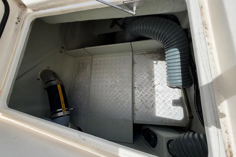 Slide: The Image of Engine compartment of a 2015 Leopard 51 Powercat with visible hoses and metal flooring. - 17