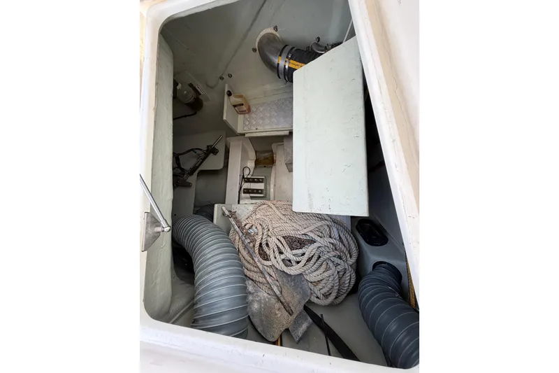 Slide: The Image of Storage compartment of a 2015 Leopard 51 Powercat with ropes and ventilation hoses. - 20
