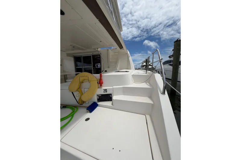 Slide: The Image of 2015 Leopard 51 Powercat yacht deck with life preserver and clear sky. - 21