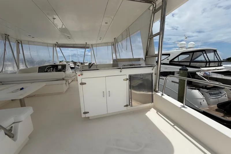 Slide: The Image of Spacious deck of 2015 Leopard 51 Powercat yacht with seating and storage. - 23