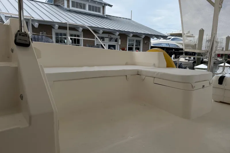 Slide: The Image of Leopard 51 Powercat 2015 yacht with spacious outdoor seating area at marina. - 24