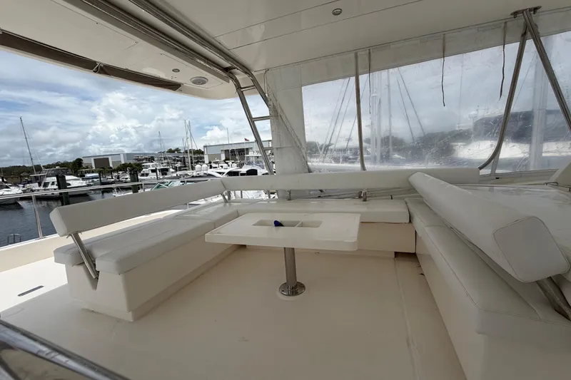 Slide: The Image of Spacious seating area on 2015 Leopard 51 Powercat yacht, docked at marina. - 25