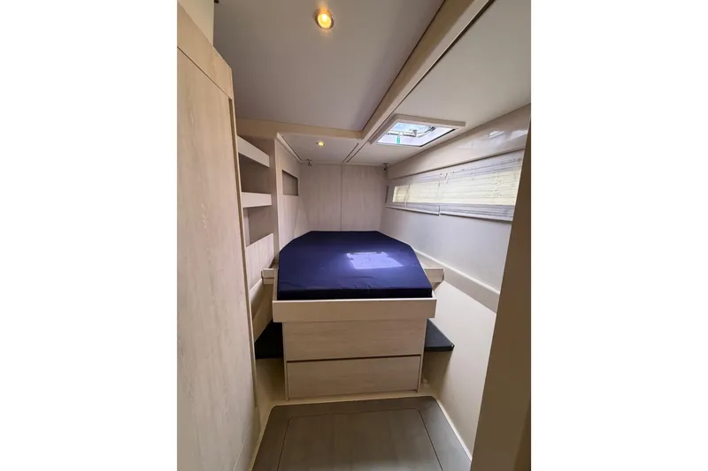 Slide: The Image of Cabin interior of 2015 Leopard 51 Powercat with bed and storage. - 35