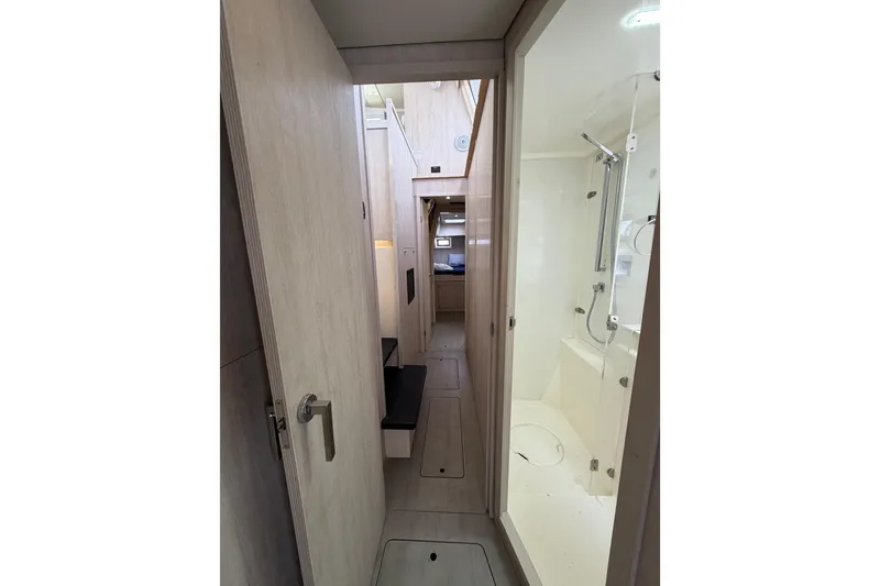 Slide: The Image of Interior of 2015 Leopard 51 Powercat featuring hallway and modern shower area. - 36