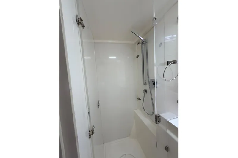 Slide: The Image of Modern shower area in 2015 Leopard 51 Powercat yacht, featuring sleek fixtures and white interior. - 38