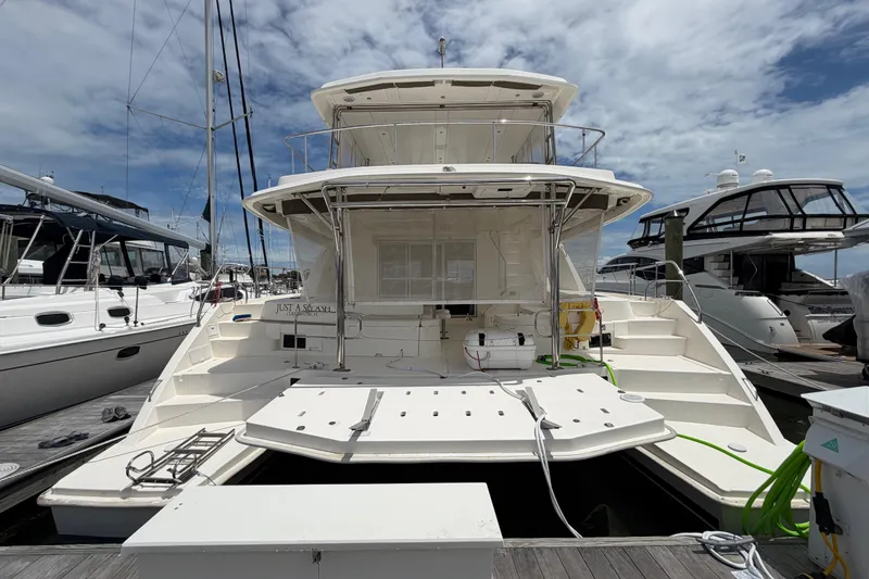 Slide: The Image of 2015 Leopard 51 Powercat yacht docked at marina under a partly cloudy sky. - 4