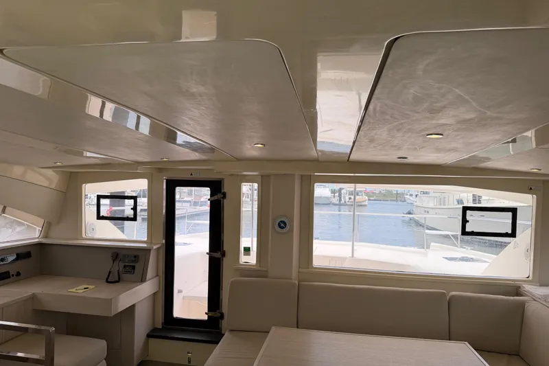 Slide: The Image of Interior of 2015 Leopard 51 Powercat yacht with spacious seating and large windows. - 44