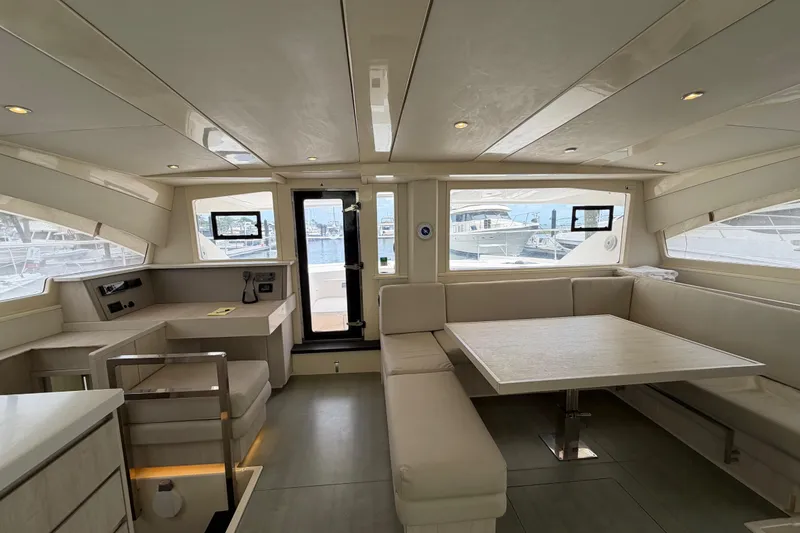 Slide: The Image of Interior of 2015 Leopard 51 Powercat yacht with modern seating and dining area. - 48