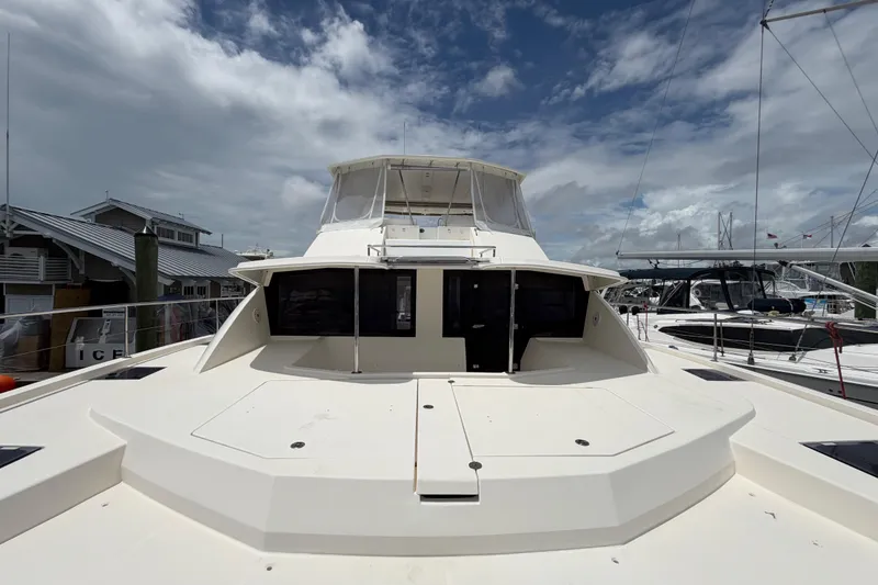 Slide: The Image of 2015 Leopard 51 Powercat yacht docked under cloudy sky. - 5