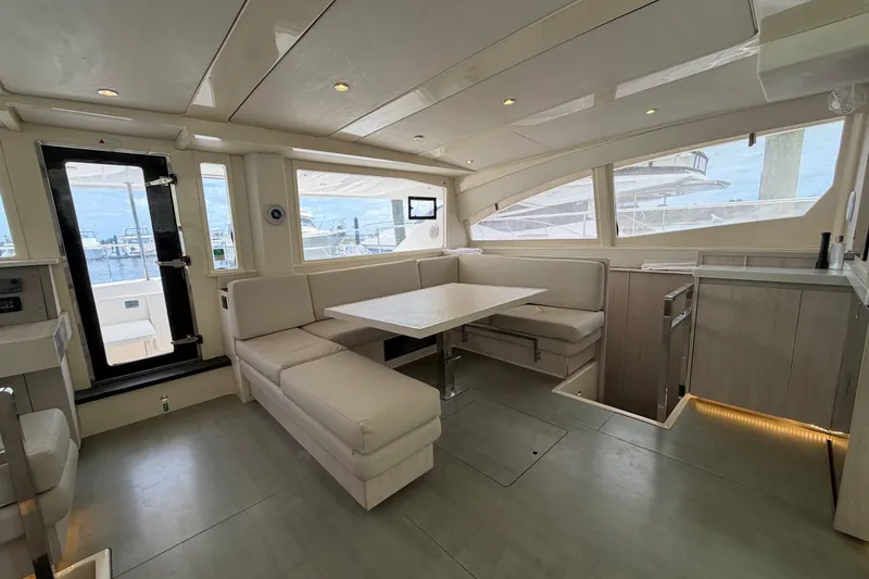 Slide: The Image of Luxurious interior of 2015 Leopard 51 Powercat yacht with modern seating and panoramic windows. - 51