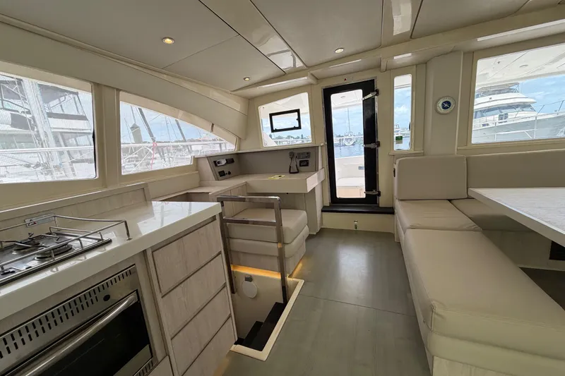 Slide: The Image of Interior of 2015 Leopard 51 Powercat yacht with modern kitchen and seating area. - 52