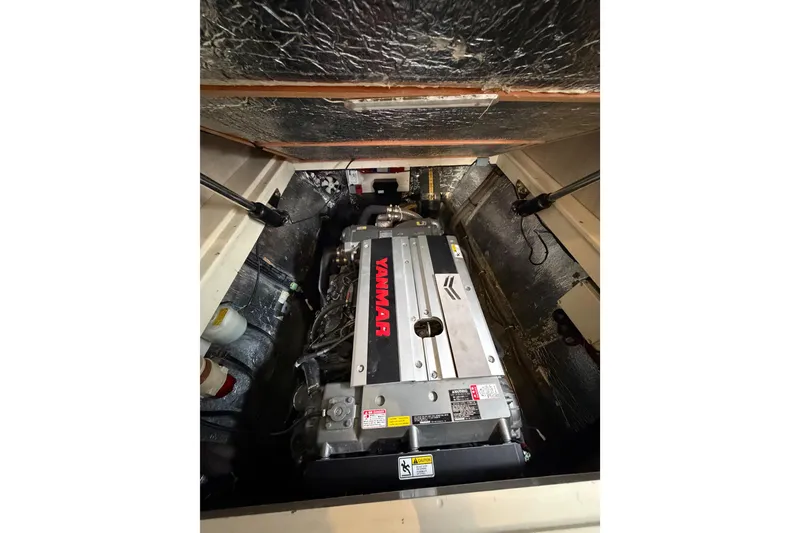 Slide: The Image of Engine compartment of 2015 Leopard 51 Powercat with Yanmar engine visible. - 56