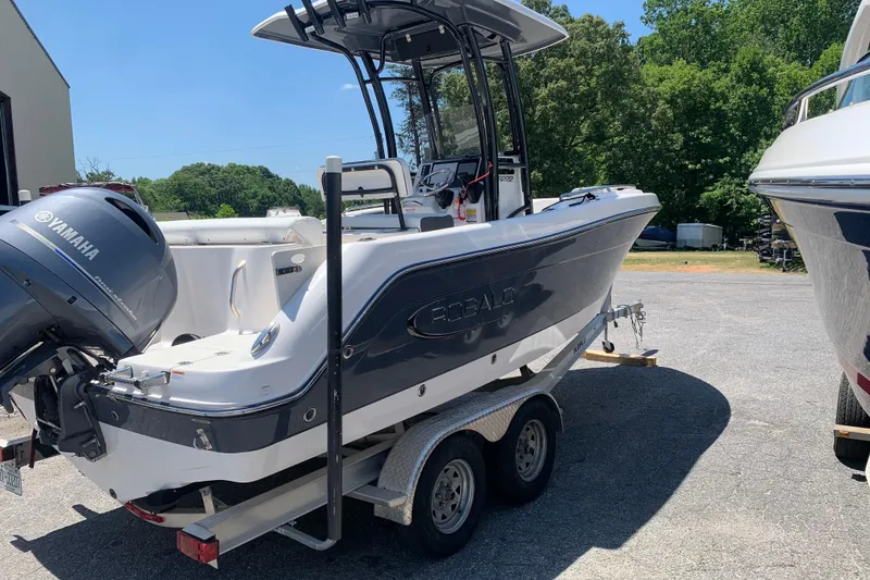 Slide: The Image of 2023 Robalo R222 Center Console boat with Yamaha engine on trailer. - 1