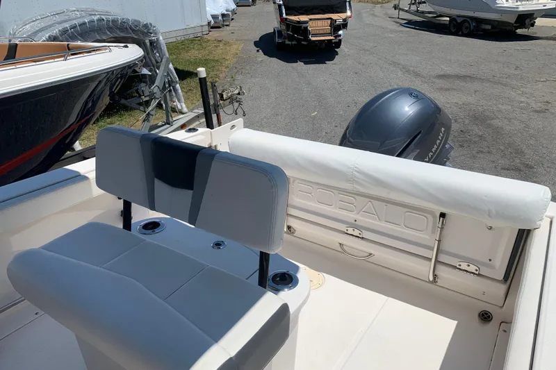 Slide: The Image of 2023 Robalo R222 Center Console boat interior with seating and Yamaha engine. - 5