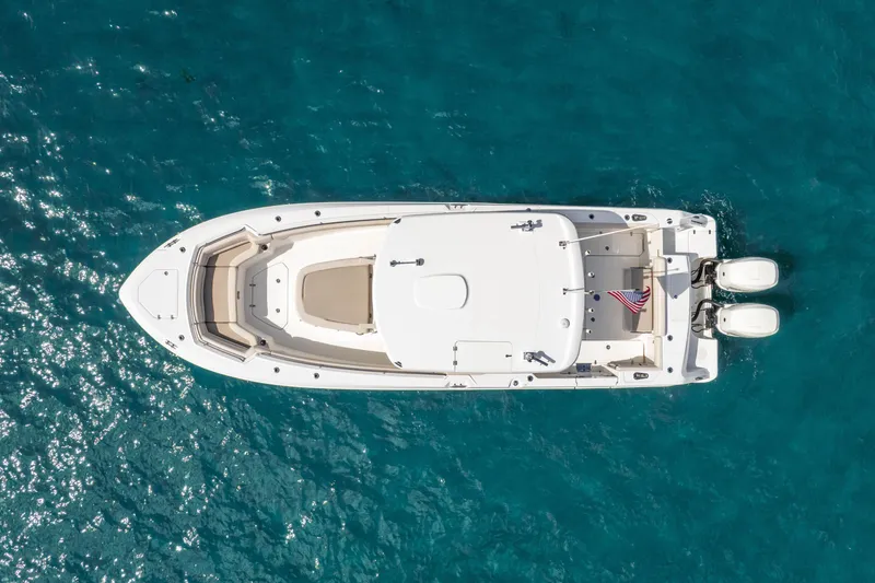 Slide: The Image of Aerial view of 2017 Boston Whaler 330 Outrage boat on clear blue water. - 13