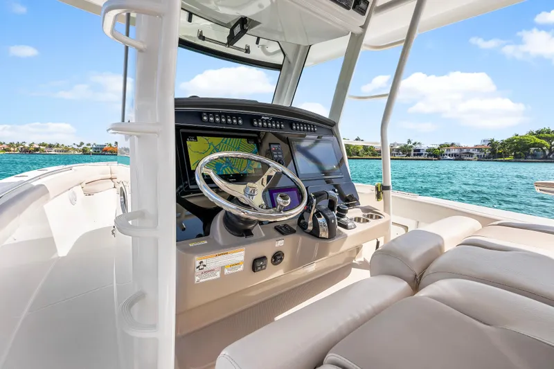Slide: The Image of 2017 Boston Whaler 330 Outrage helm with advanced navigation system on a sunny day. - 20