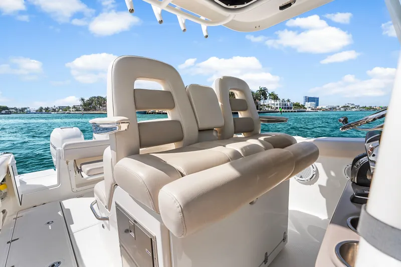 Slide: The Image of Luxurious seating on 2017 Boston Whaler 330 Outrage boat, cruising on clear blue waters. - 22