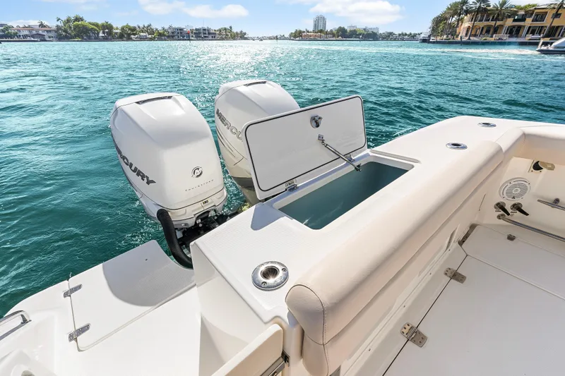 Slide: The Image of 2017 Boston Whaler 330 Outrage boat with twin Mercury engines on a sunny day. - 36
