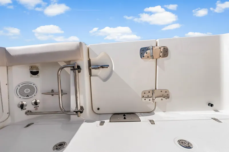 Slide: The Image of 2017 Boston Whaler 330 Outrage boat deck with stainless steel fittings under blue sky. - 37