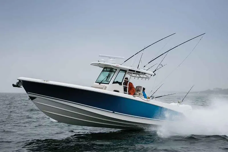 Slide: The Image of Manufacturer Provided Image: Boston Whaler 330 Outrage 2017 boat table with fruit platter and drink. - 43