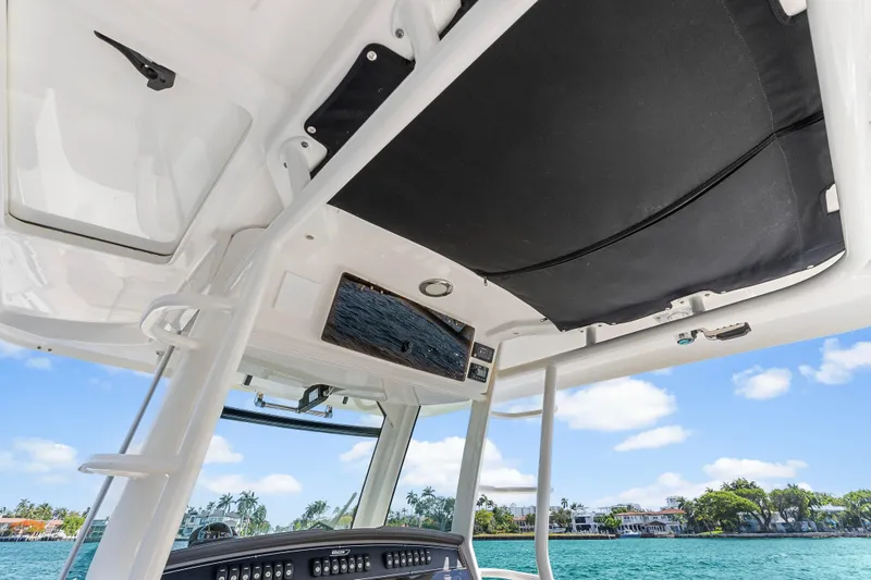 Slide: The Image of Interior view of 2017 Boston Whaler 330 Outrage boat with ocean backdrop. - 45