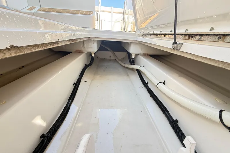 Slide: The Image of Bilge area of a 2011 Sea Ray 270 SLX boat, showing clean interior and wiring. - 16