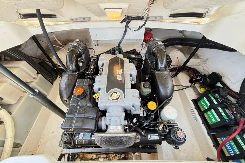 Slide: The Image of Engine compartment of a 2011 Sea Ray 270 SLX boat, featuring a powerful 8.2 engine. - 21