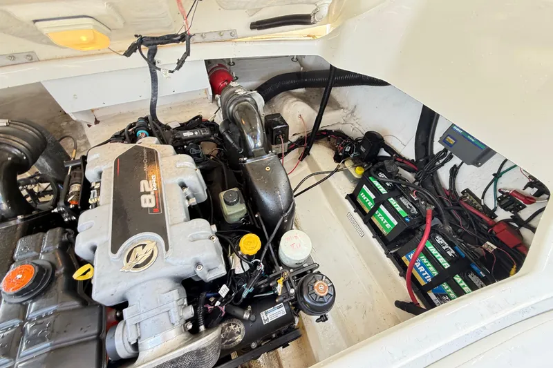Slide: The Image of Engine compartment of a 2011 Sea Ray 270 SLX boat, featuring an 8.2L V8 engine. - 22