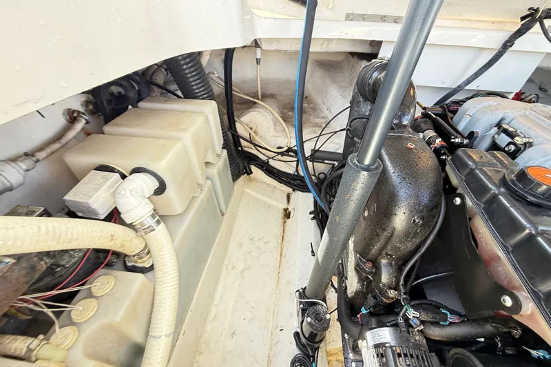 Slide: The Image of Engine compartment of a 2011 Sea Ray 270 SLX boat, showing mechanical components. - 24
