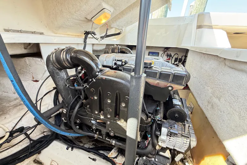 Slide: The Image of Engine compartment of a 2011 Sea Ray 270 SLX boat, showcasing mechanical components. - 25