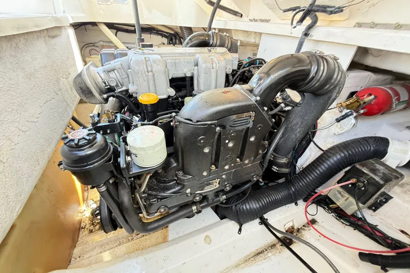 Slide: The Image of Engine compartment of a 2011 Sea Ray 270 SLX boat, showcasing detailed components. - 26