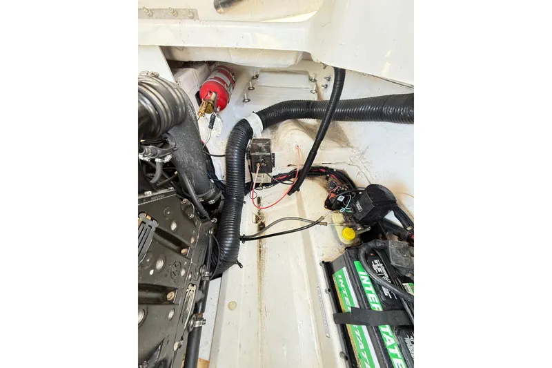 Slide: The Image of Engine compartment of a 2011 Sea Ray 270 SLX boat, showing wiring and components. - 27