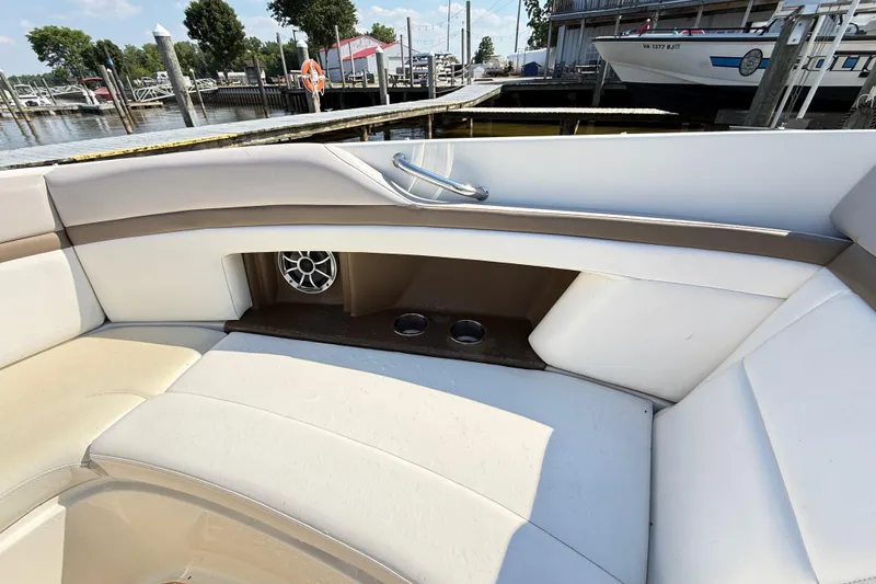 Slide: The Image of Interior seating of a 2011 Sea Ray 270 SLX boat at a marina. - 40