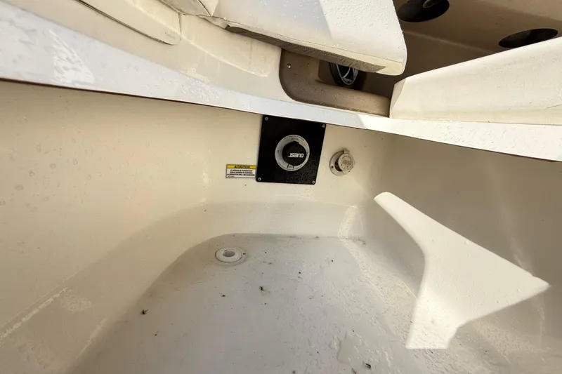 Slide: The Image of Interior view of a 2011 Sea Ray 270 SLX boat, showing seating and storage area. - 47