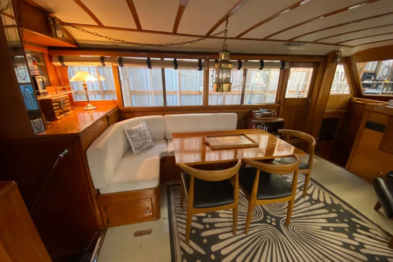 Slide: The Image of Interior of a 1939 Elco Motor Yacht with elegant wood and cozy seating. - 10