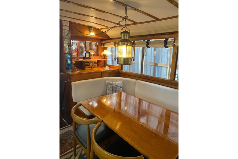 Slide: The Image of Interior of 1939 Elco Motor Yacht with polished wood table and vintage lighting. - 20