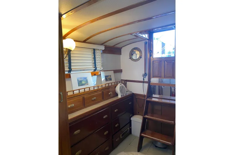Slide: The Image of Interior of 1939 Elco Motor Yacht with wooden cabinetry and nautical decor. - 23