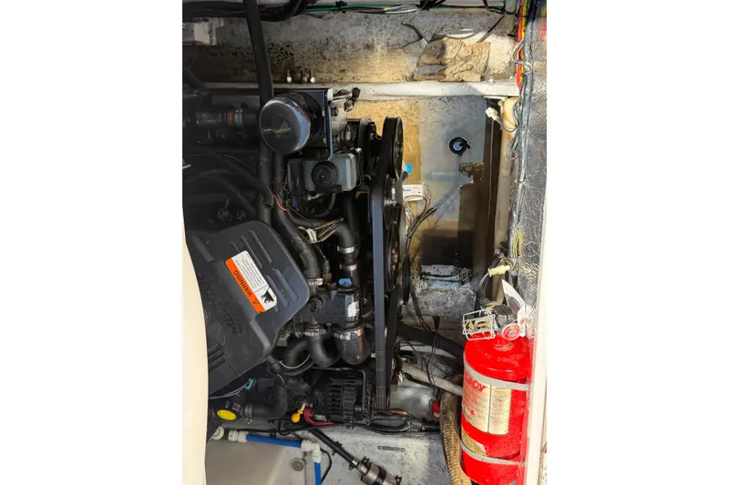 Slide: The Image of Engine compartment of a 2004 Four Winns 268 Vista boat with visible fire extinguisher. - 21
