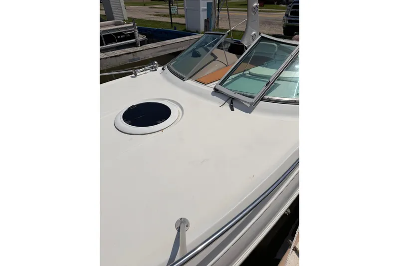 Slide: The Image of 2004 Four Winns 268 Vista boat deck with open windshield and hatch. - 5